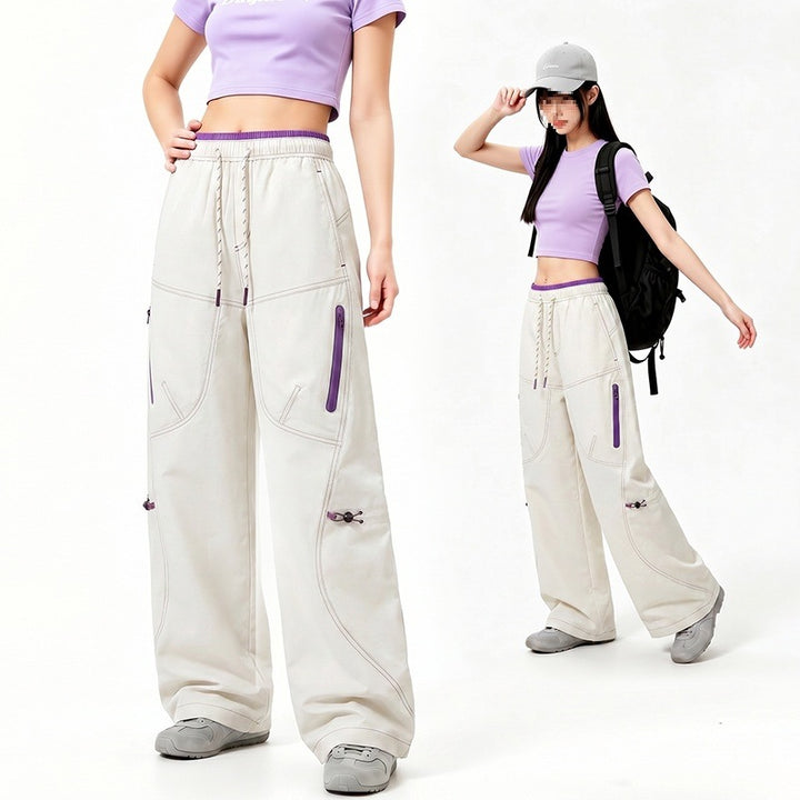 Damen Oversize Tech-Loungehose mit Kontrastnähten, reflektierenden Reißverschlusstaschen & Kordelbund Drune