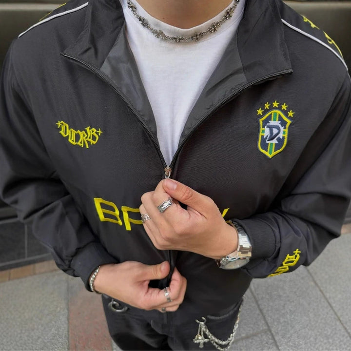 Unisex nan sportliche Retro-Trainingsjacke mit Stehkragen Reißverschluss Brustemblem und Brasilien-Schriftzug Drune