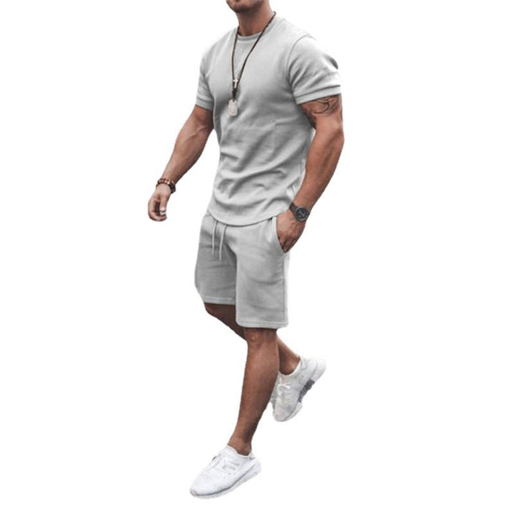 Herren nan figurbetontes Kurzarmshirt mit verstärkter Schulternaht und elastischer Kordelzug-Bermuda aus Stretchjersey Drune