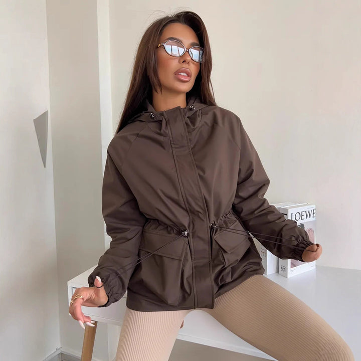 Damen wasserdichte Parka-Jacke mit Kapuze, Tunnelzugtaillierung und XXL-Klappentaschen Drune