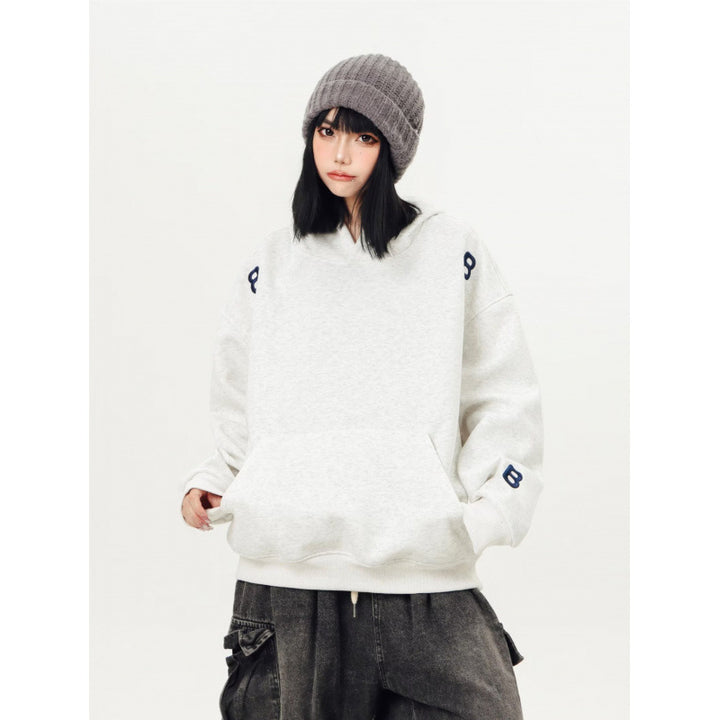 Unisex Oversized Kapuzenpullover mit großflächigem Intarsien‑Blockprint und geripptem Saum Drune