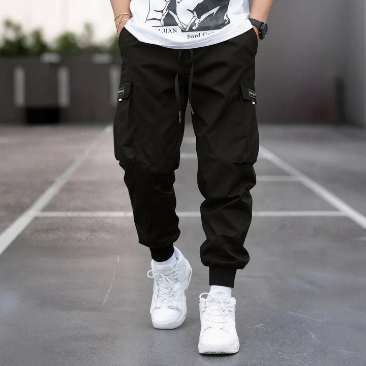 Herren Tapered Cargo-Joggerhose mit elastischem Tunnelzug, verstärkten Klappentaschen & gerippten Knöchelbündchen Drune
