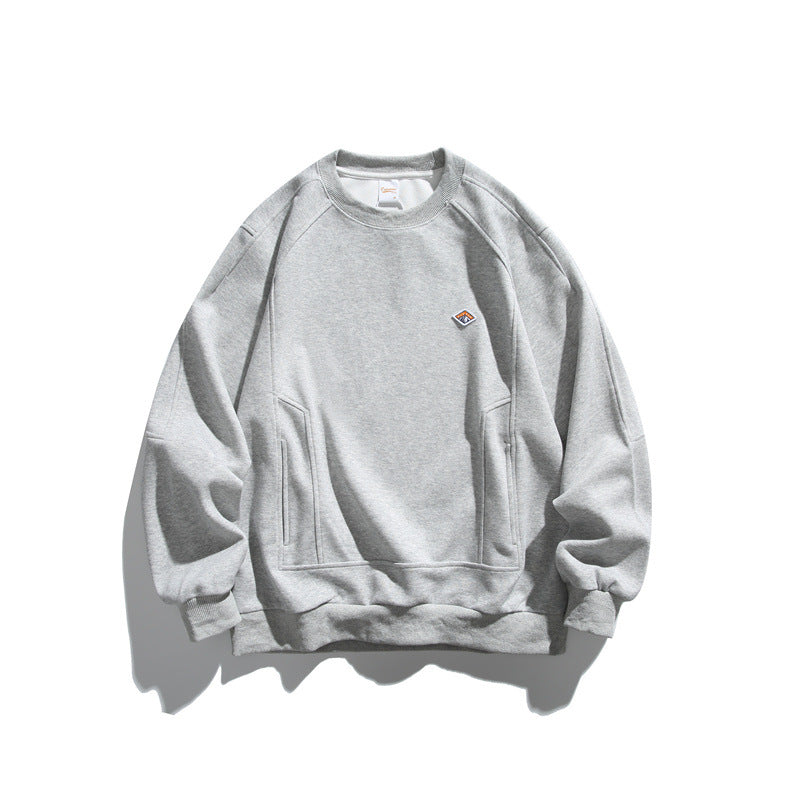 Unisex Oversize-Sweatshirt aus French-Terry mit Raglanärmeln, verdeckten Eingrifftaschen und kleinem Logopatch Drune