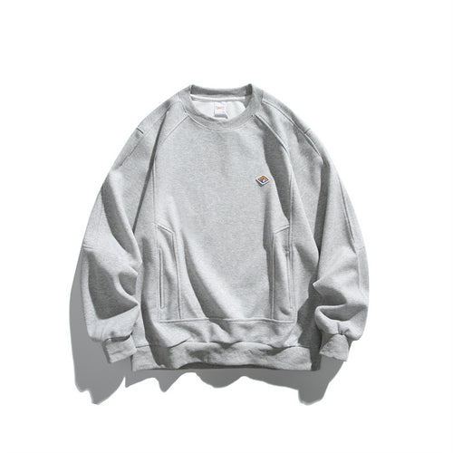 Unisex Oversize-Sweatshirt aus French-Terry mit Raglanärmeln, verdeckten Eingrifftaschen und kleinem Logopatch Drune