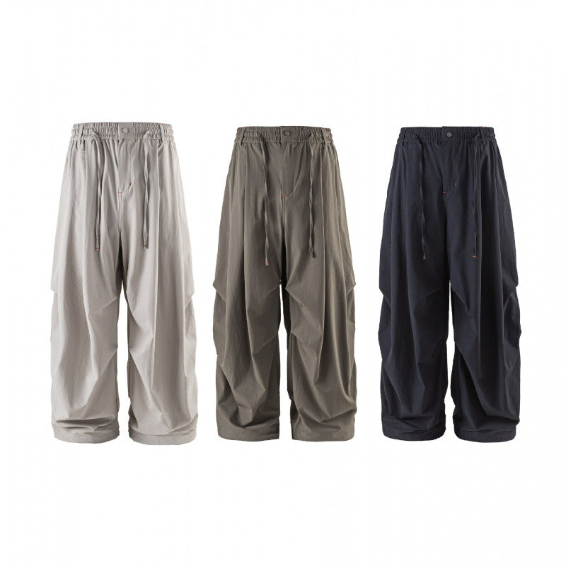 Unisex Weitgeschnittene technische Cargo-Hose mit Gummibund, Kordelzug und Reißverschlusstaschen Drune