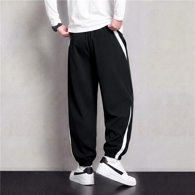 Herren Athleisure Jogginghose im Baggy‑Schnitt mit elastischem Bund, Tunnelzug und seitlichen Kontrastkeilen Drune