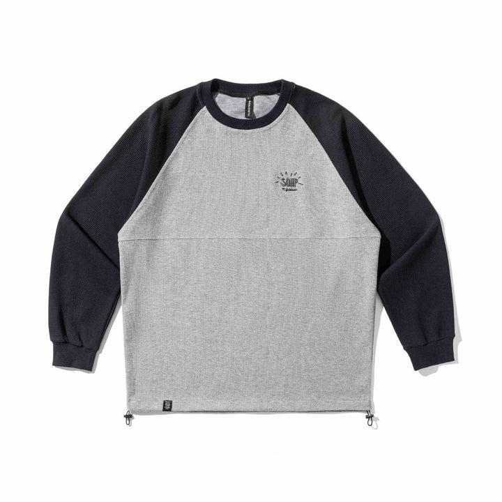 Unisex Raglan‑Sweatshirt mit Thermowaffelstruktur, Kordelzugsaum und dezenter Bruststickerei Drune