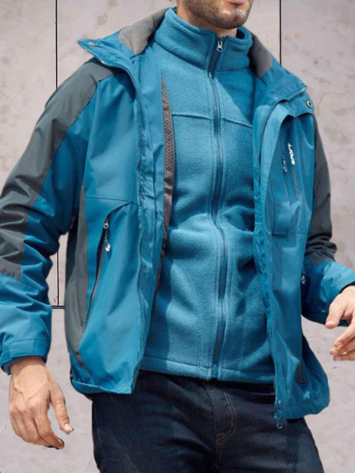 Drune | Wind- und wasserdichte Wanderjacke mit Kapuze, Taschen und doppeltem Reißverschluss und Knopfverschluss