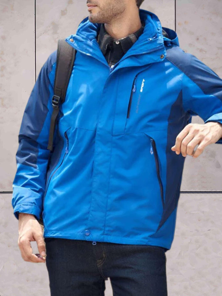 Drune | Wind- und wasserdichte Wanderjacke mit Kapuze, Taschen und doppeltem Reißverschluss und Knopfverschluss