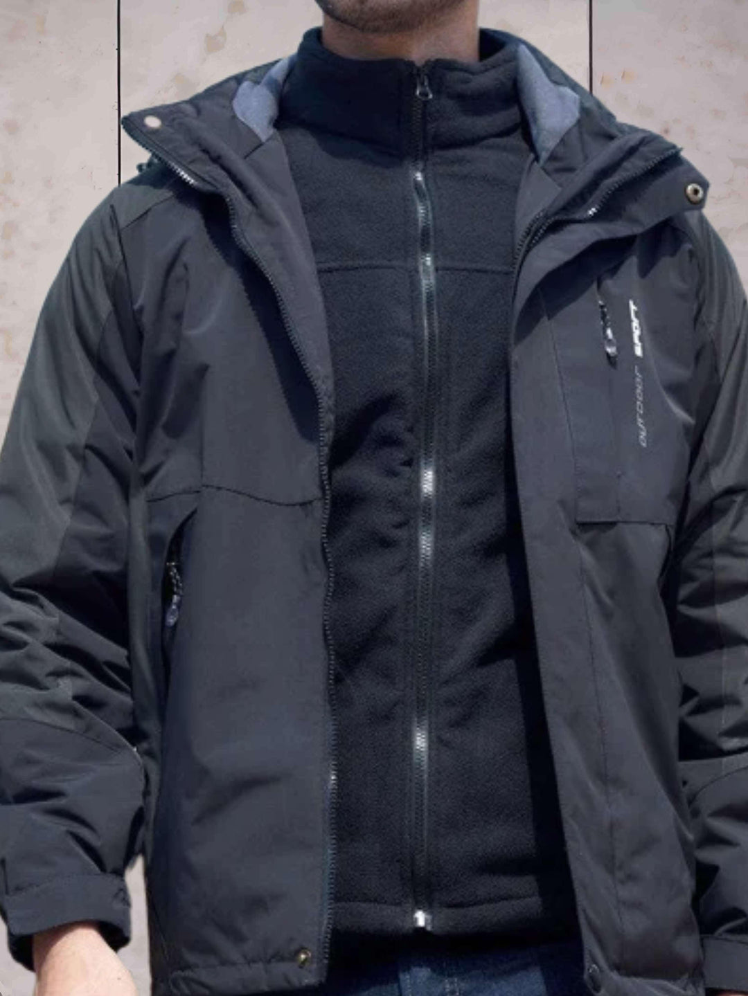 Drune | Wind- und wasserdichte Wanderjacke mit Kapuze, Taschen und doppeltem Reißverschluss und Knopfverschluss