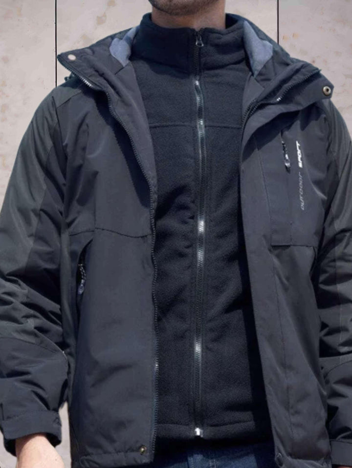 Drune | Wind- und wasserdichte Wanderjacke mit Kapuze, Taschen und doppeltem Reißverschluss und Knopfverschluss
