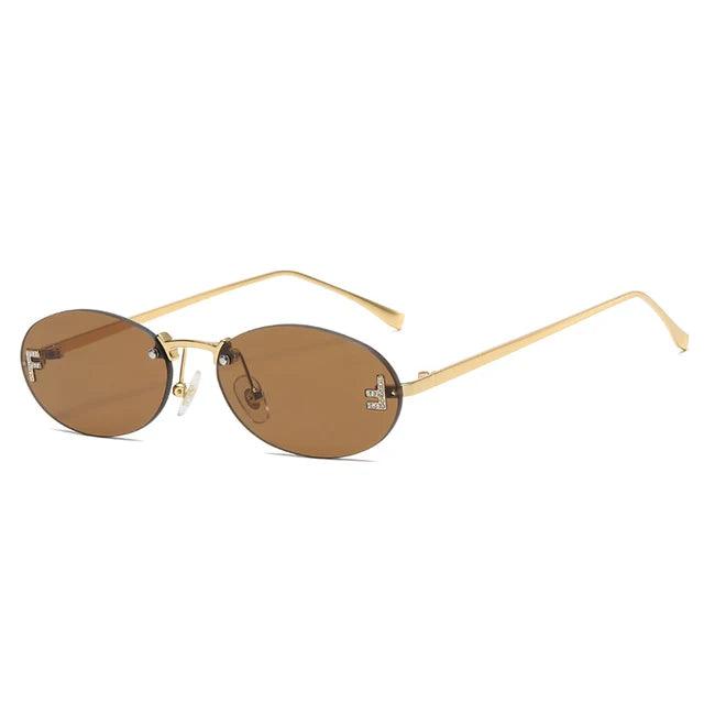 Drune | Ovale Sonnenbrille Mit Goldenen Akzenten Und Subtilen Steinen