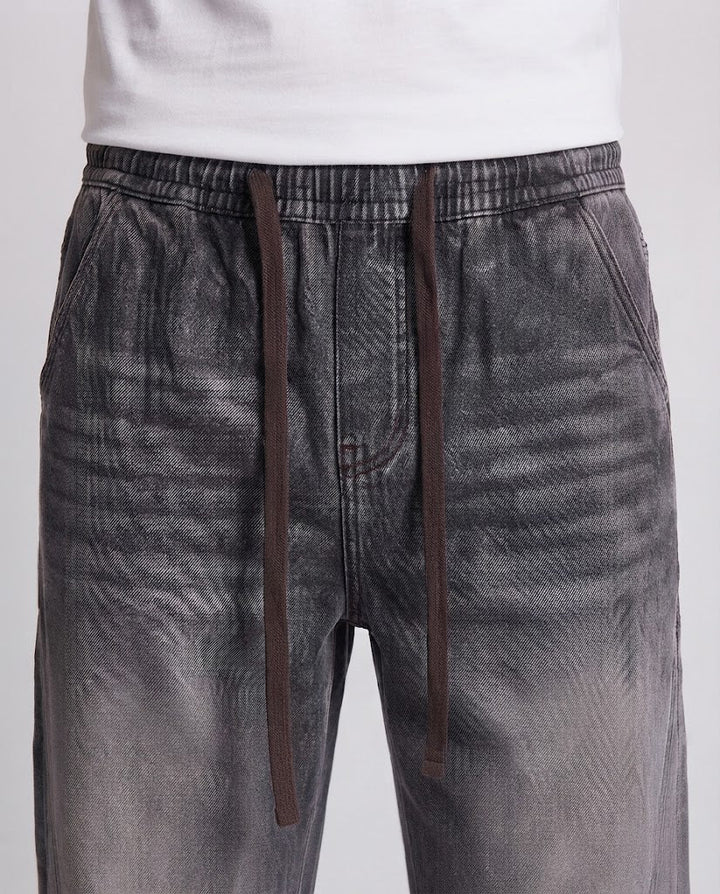 Herren weite Stonewash-Denimhose mit Kordelzug und Kontrastnähten Drune